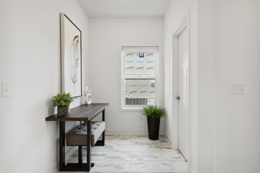 (Photo of model home, finishes will vary). The mudroom for shoe and jacket storage.