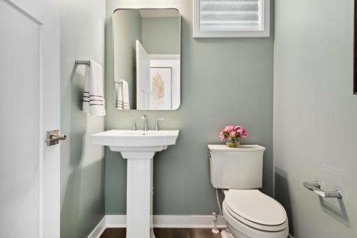 (Photo of model home, finishes will vary) Directly off the kitchen, this powder room optimizes the first-floor living area for residents and guests alike.