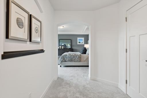 (Photo of model home, finishes will vary) French doors open to the tranquil owner’s suite.