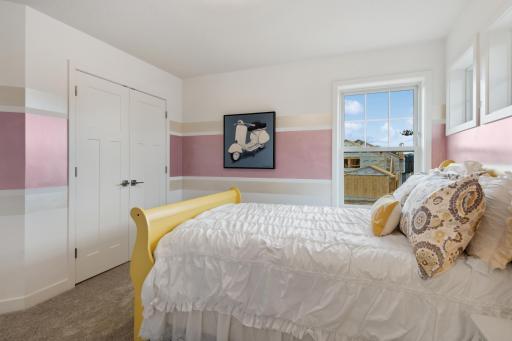 (Photo of model home, finishes will vary). Ideal for residents that require more personal space and privacy, this bedroom includes an attached full-sized along with a cozy nook by the window.
