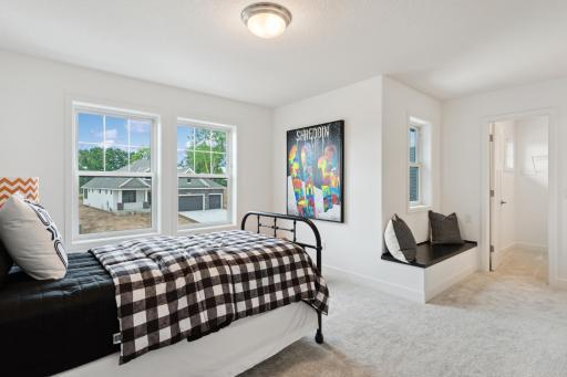 (Photo of model home, finishes will vary) Versatile in nature, this large upper-level bedroom can host twin bunk beds for younger residents that want to double up.
