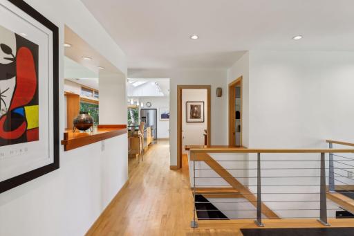 Lovely maple flooring extends through from the front hall to the living room, dining room, office and kitchen for continuity.