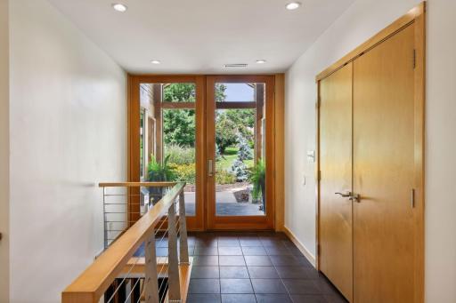 Stylish double entry doors greet you. The sun-splashed foyer is enhanced with tiled flooring and a guest coat closet.