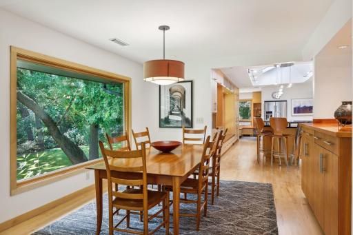 The dining room offers a large window with treetop views, and there are built-in cabinets to store your fine china and glassware.