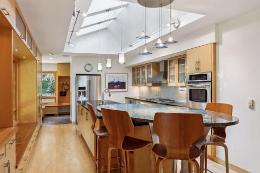 The gorgeous kitchen has been stylishly updated with abundant maple and cherry custom-designed cabinetry.