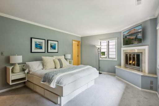 Large windows offer treetop views of the backyard.