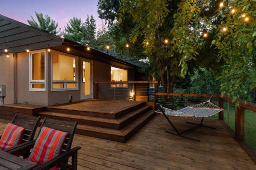 The mature trees screen the yard for privacy and create a peaceful setting for relaxation.