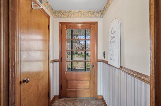 This is the front door walking into the living room with coat closet.