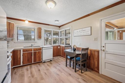 The kitchen has been nicely updated with paint, flooring, appliances, counters and backsplash.
