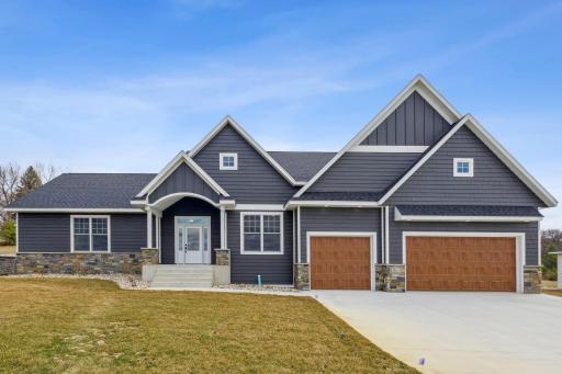 Welcome to timeless elegance and sophisticated living in this exceptional custom-built residence!