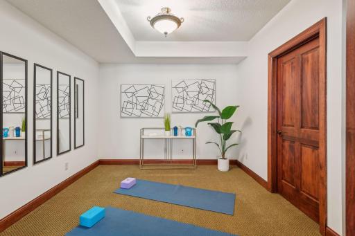 Stay fit and energized in this fully equipped in-home gym, designed for both functionality and comfort to support your active lifestyle.