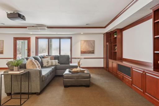 Create unforgettable movie nights in this dedicated entertainment room, designed for ultimate comfort with space to relax, unwind, and enjoy.