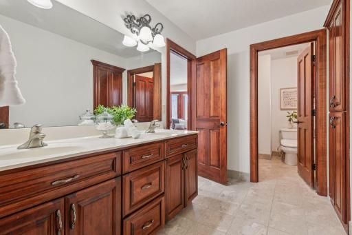 This elegant upper-level bath combines style and sophistication, featuring high-end finishes, ample space, and a serene ambiance for ultimate relaxation.