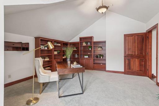 Enjoy productivity and comfort in this expansive upper-level office.