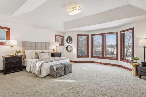 Step into your personal sanctuary in this massive primary suite. Featuring an attached spa-inspired bath retreat and generous custom closet spaces, this luxurious haven blends elegance and comfort.