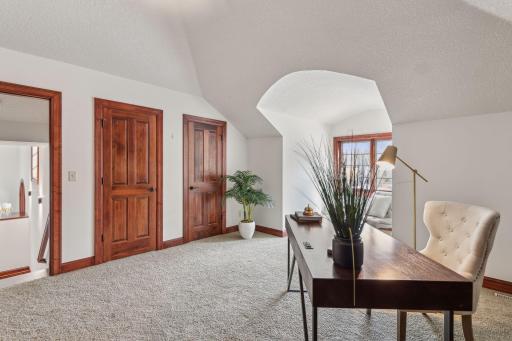 This upper-level office offers the perfect blend of sophistication and function, complete with built-ins. Expansive windows let in beaming light.