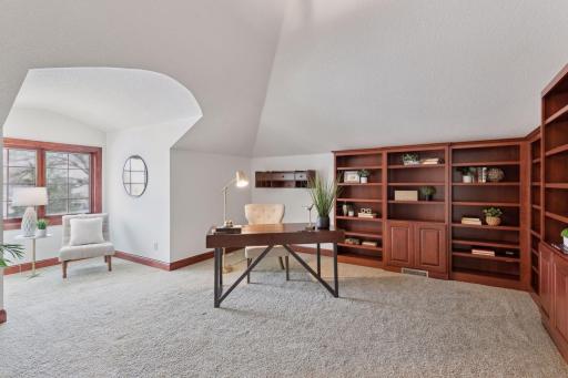 Work in style in this luxury office featuring custom built-ins, with a spacious layout.