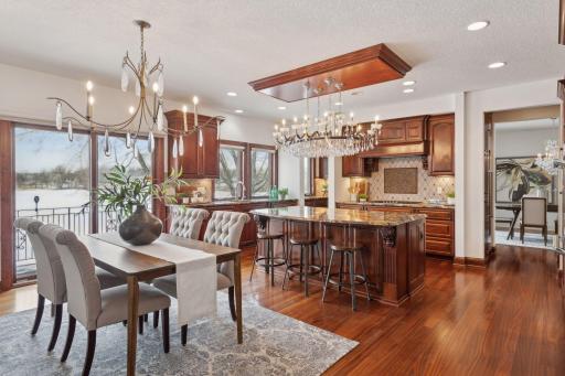 An open-concept luxury kitchen that flows seamlessly into the informal dining space, perfect for both casual meals and entertaining. High-end finishes and thoughtful design make this the heart of the home.