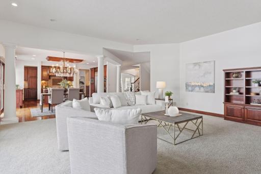 An expansive family room designed for luxury and comfort, this open-concept space is the perfect setting for quality family time, blending style and functionality for both relaxation and entertaining.