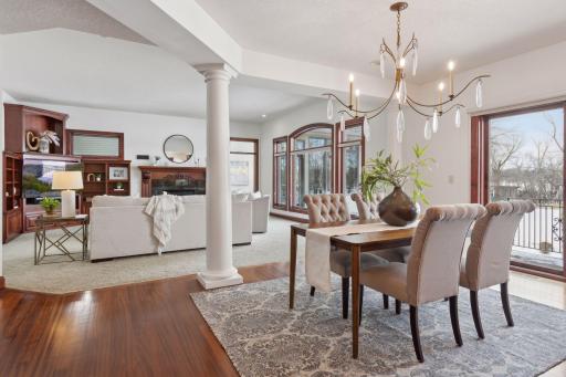 Enjoy casual dining in this inviting informal dining space, seamlessly adjoining the open-concept kitchen, all with breathtaking lake views that add a serene touch to every meal.