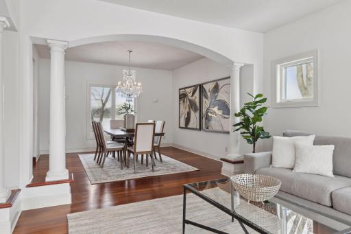 Elegant and inviting, this formal dining room features a stunning chandelier and breathtaking lake views, offering the perfect backdrop for memorable gatherings.