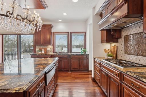 Crafted for the discerning chef, this high-end kitchen boasts state-of-the-art appliances, a professional-grade gas range, and stylish tiling that combines both form and function for a truly exceptional cooking experience.