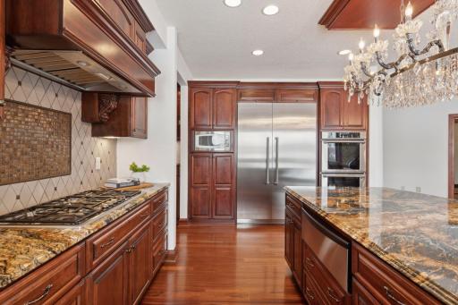 This kitchen is equipped with all the modern conveniences, including a specialized glassware dishwasher, ensuring both style and practicality for effortless entertaining and everyday living.