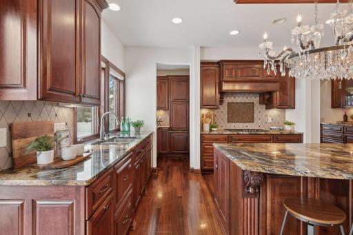 Incredibly Designed Chef's Kitchen complete with Custom Cherry Cabinetry, Granite Counters and Commercial Appliances.