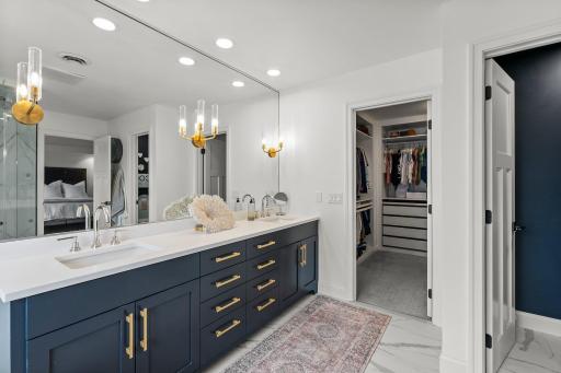 Remodel with new vanity, mirror, lights and marble counter tops/double sink.