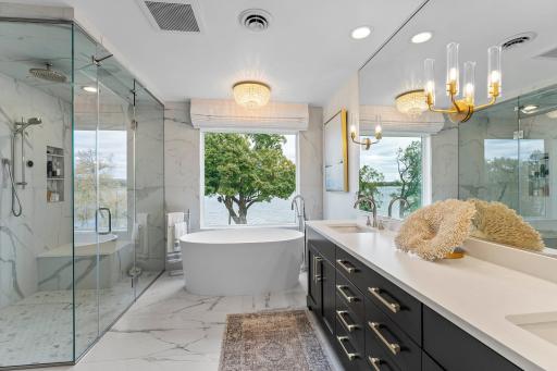 Complete remodeled primary en-suite with heated floors, soaking tub, double sink and steam shower!