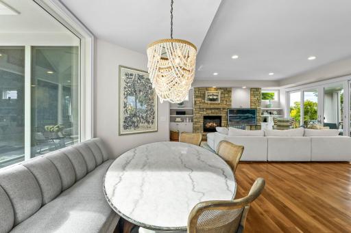 Eat-in kitchen area with custom designed table and chairs and new light fixtures