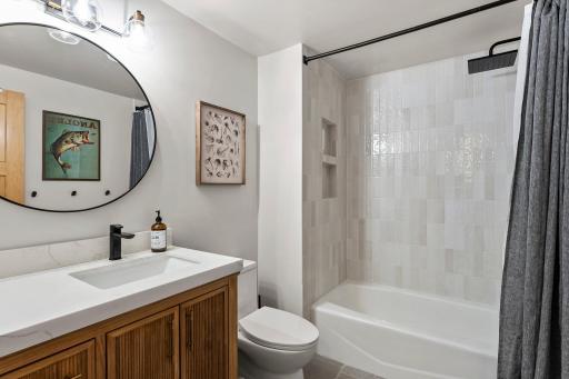 Completely remodeled lower level with fully tiled tub/shower