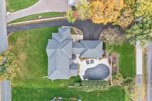 Aerial view showing off the BRAND NEW roof and pool cover!
