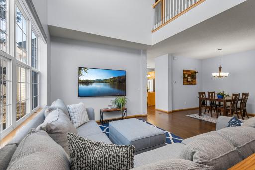 Living room with upper loft and separate dining room