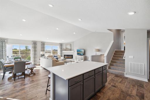 Open concept Kitchen, dining, and family room. Photos are of a similar model home. Actual home is under construction.