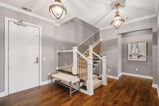 The foyer area with stairs leading to the upper loft
