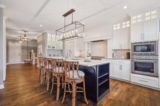 Large center island is ideal for meal prep or grabbing a quick bite to eat
