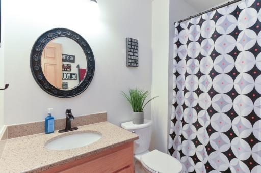 Upper Level full bath with tile floors and quartz vanity top