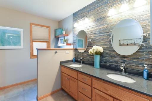 Primary bath is a retreat with quartz vanity top, dual sinks, and a huge walk in shower and tile surround