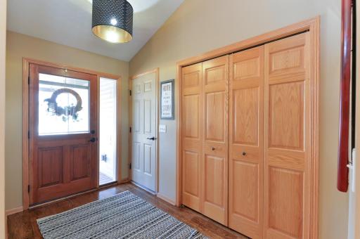 Entryway with new lighting and showing the way to the garage