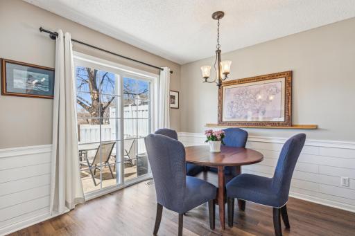 Dining area w ship lap details and sliding doors to spacious patio