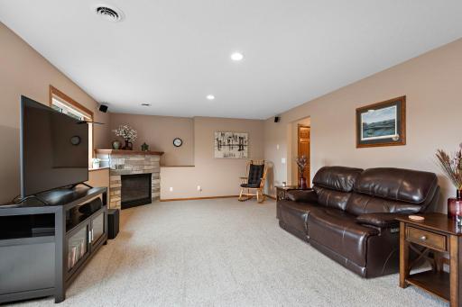 Beautiful lower level Family Room has corner gas fireplace, LED lighting and walks out to patio - outside wiring for your future hot tub!