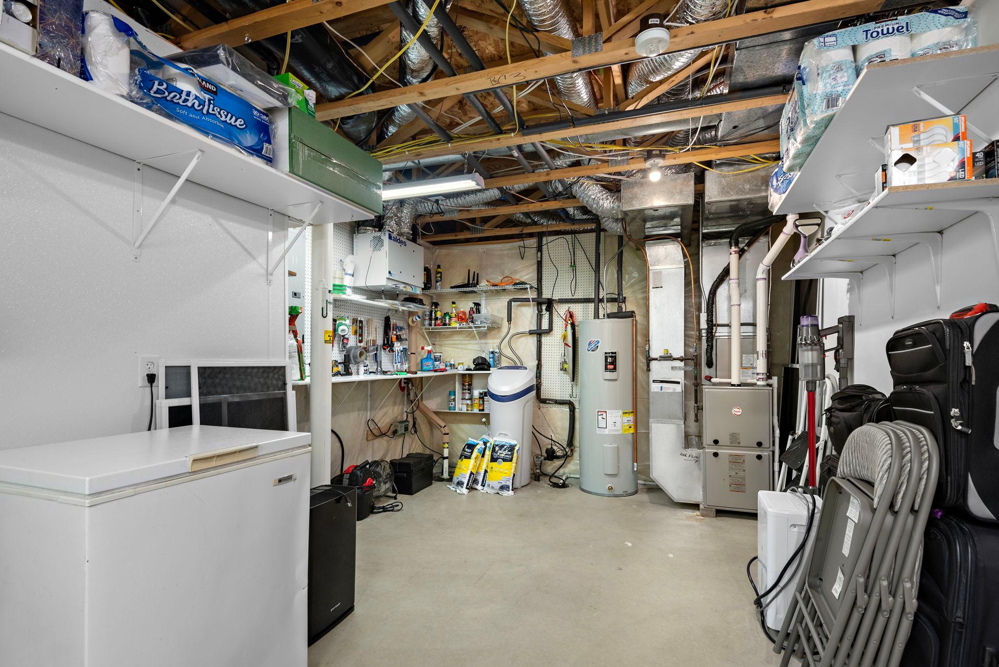 Lower Level laundry and utility room has utility sink with lots of storage space!