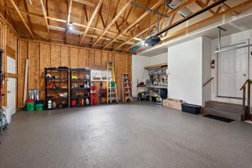 Garage Lovers Dream with Epoxy Flooring, new garage door & garage door opener and service door to backyard!