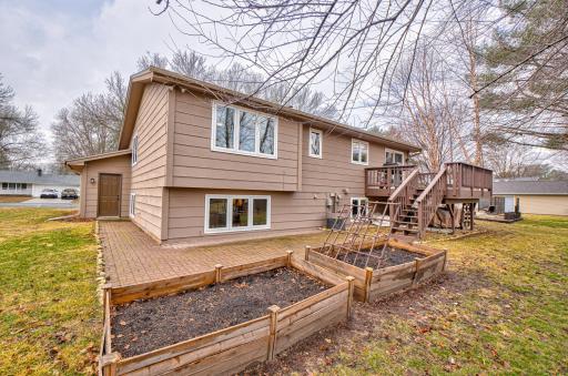 Outside, you'll find a spacious, private backyard with a generous patio, raised garden beds, and an attached 2-car garage offering optimal storage solutions.