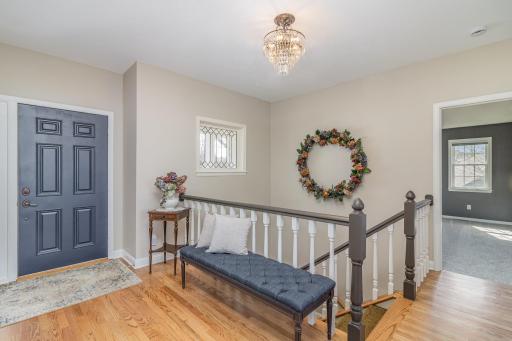 Large entryway with gorgeous hardwood flooring.