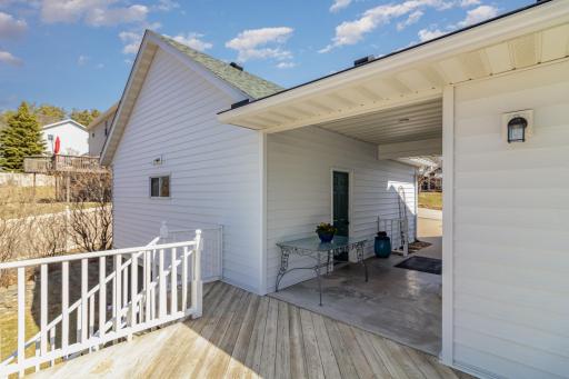 Detached garage with a covered breezeway and deck off the informal dining space