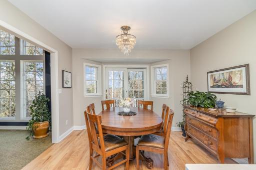 Informal dining space with access to deck overlooking the backyard.