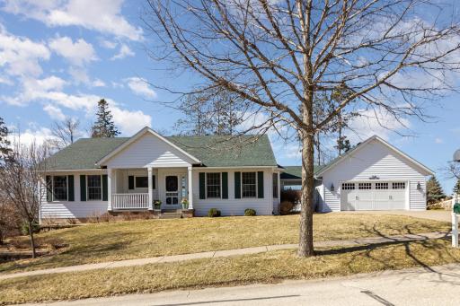 Stunning Red Wing rambler, featuring 5 bedrooms, 3 bathrooms, a two stall detached garage and additional tuck-under garage.