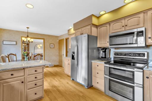 Beyond kitchen is the formal dining room.